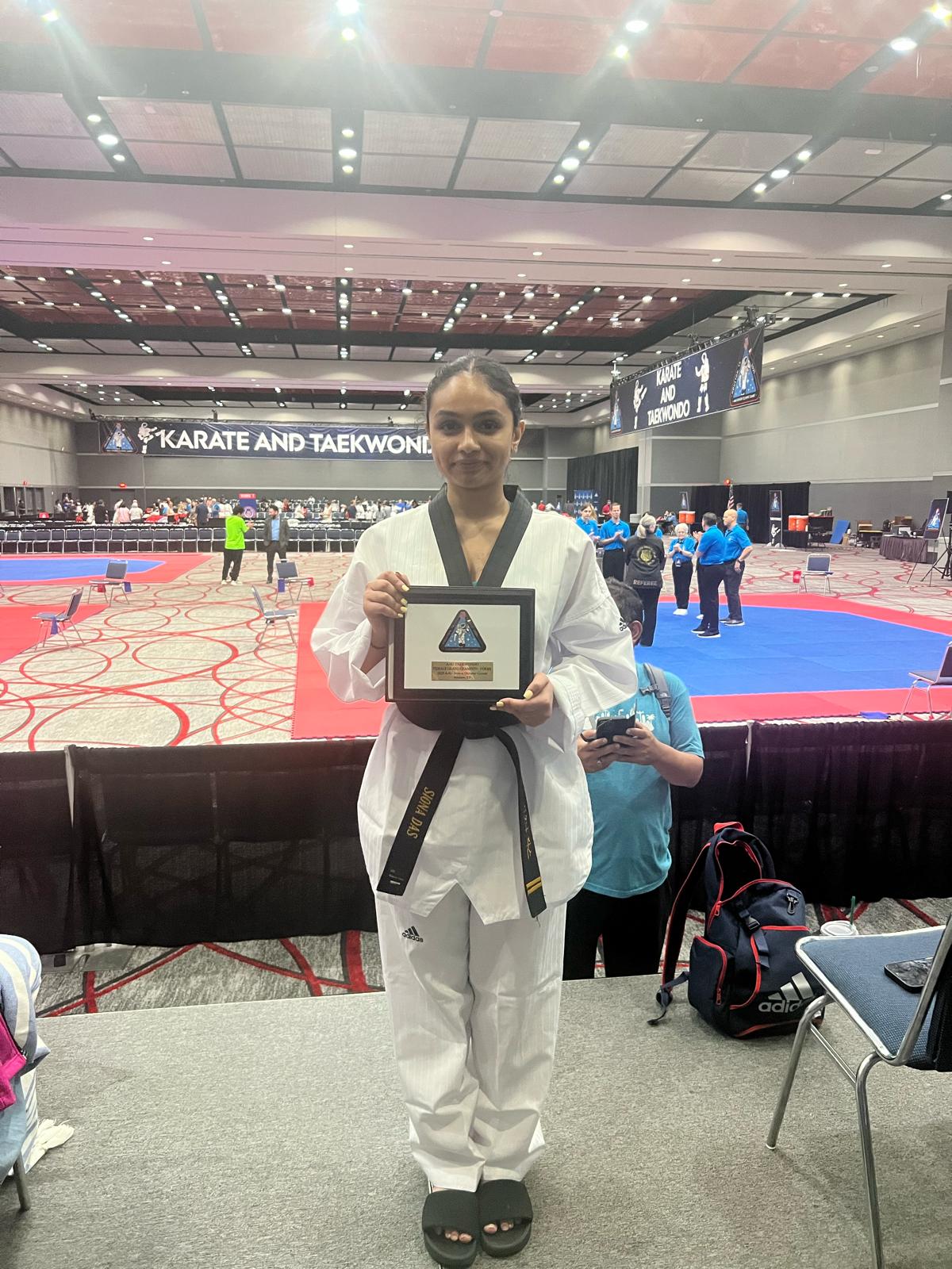 Siona receives recognition at a national martial-arts event.