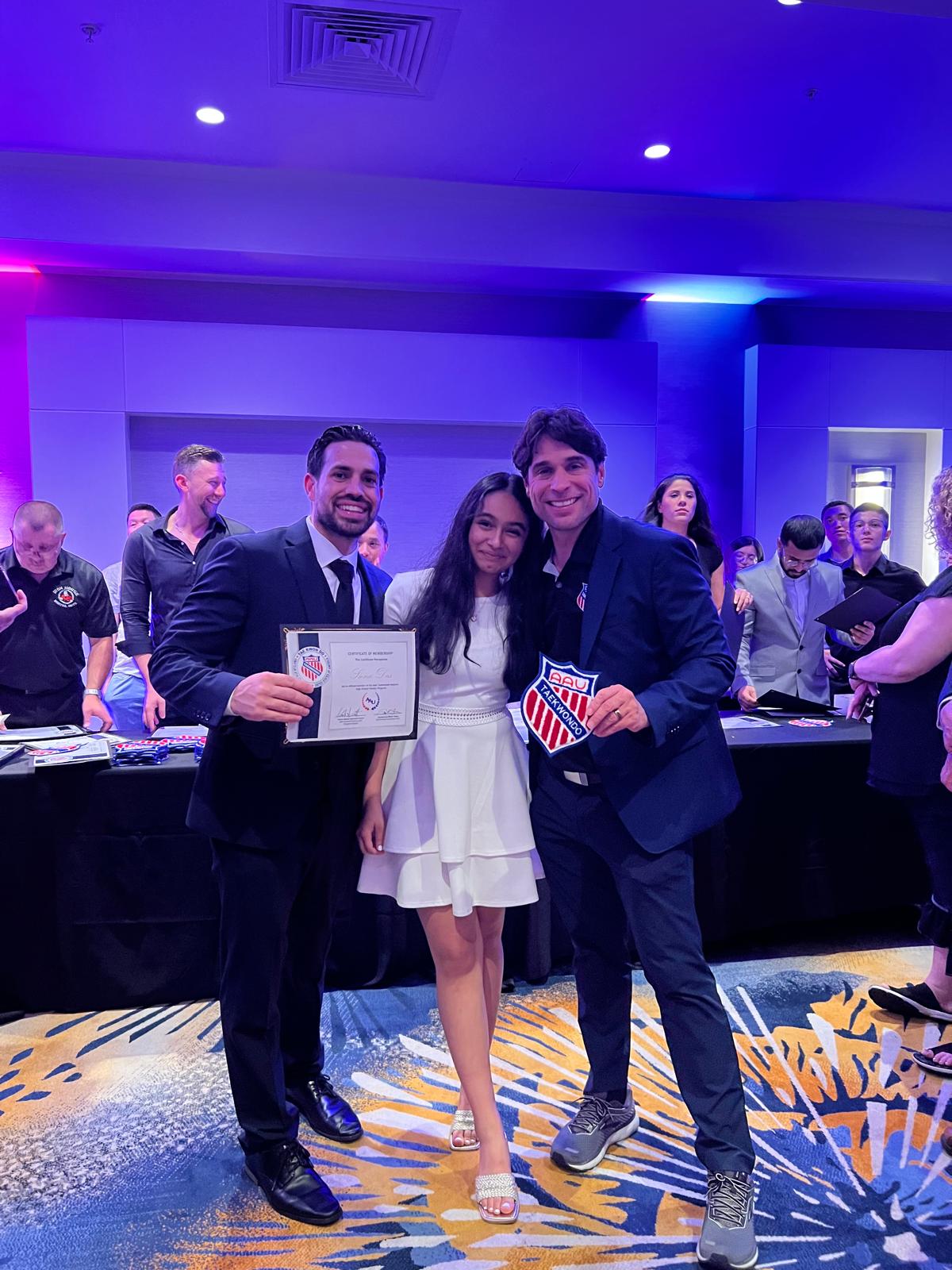 Siona receives recognition for achievement in Taekwondo.